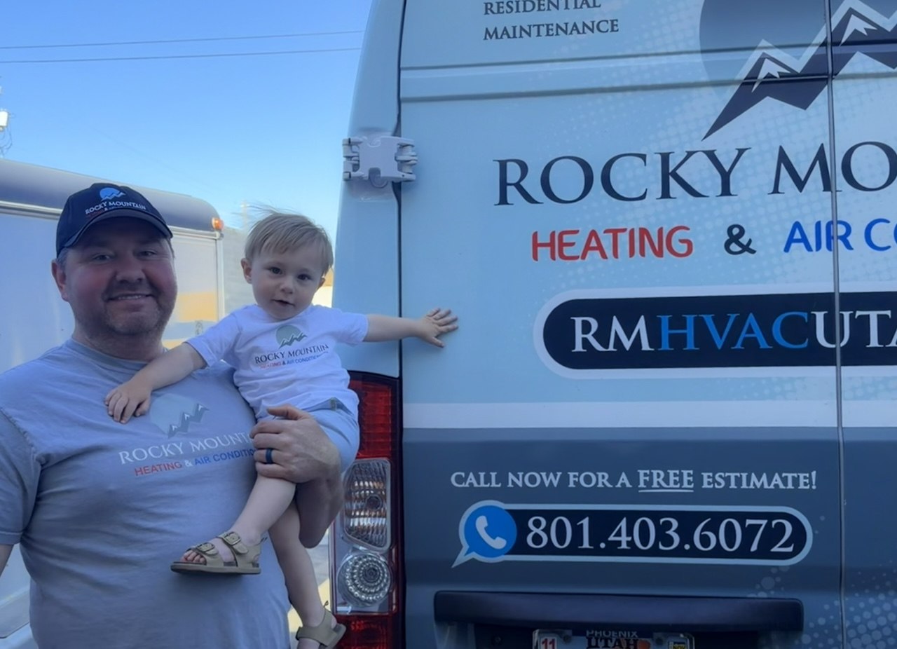 Ben, owner of Rocky Mountain Heating and Air Conditioning, with his child